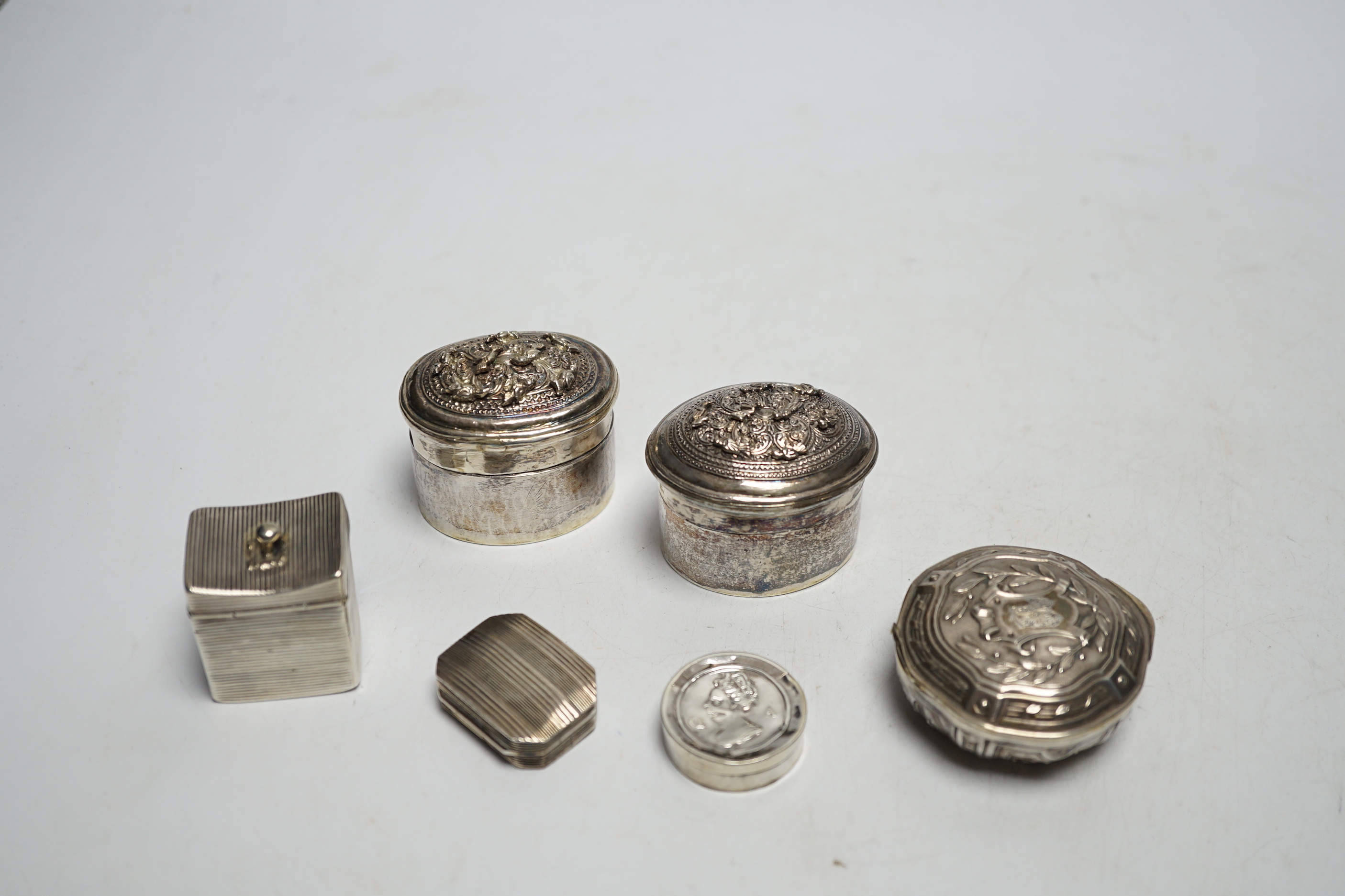 Assorted silver and white metal pill boxes, including Dutch, together with a 19th century vinaigrette by Samuel Pemberton, 30mm.